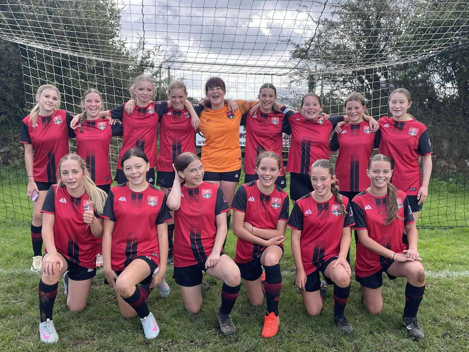 Redruth United girls squad team photo in front of the goal