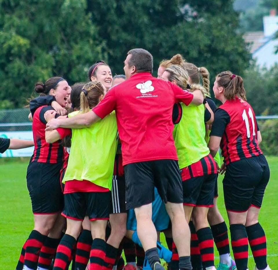 Redruth United women's team celebrating an FA Cup victory together at Clijah Park